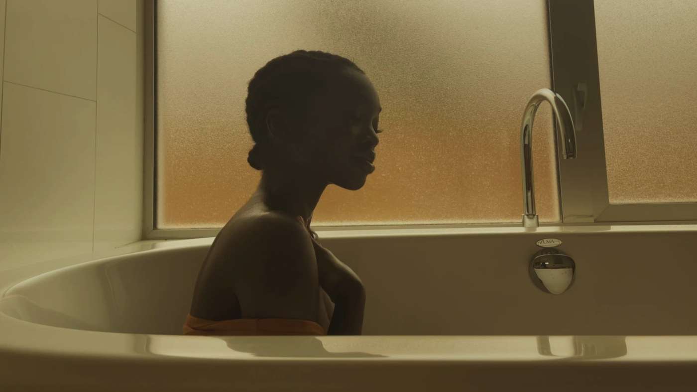 A figure at a bath, from a film by Deun Ivory
