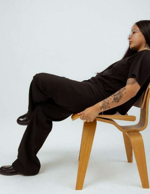 DJ Kay Illah seated, from her press sheet