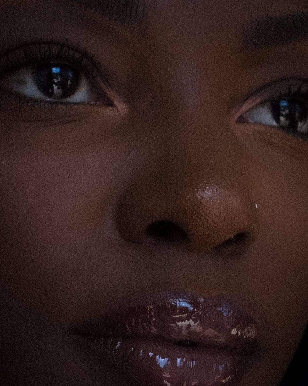 A close-up of Kristen’s eyes and glossed lips, from Deun Ivory’s portraits of Kristen for VSCO